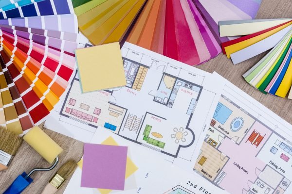 Architectural concept - home plan, color and wooden samples, brush