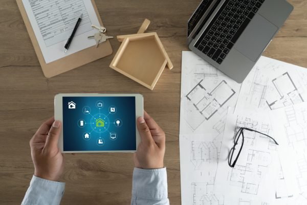 Real estate agent signing a contract over a house key  real estate  home loan