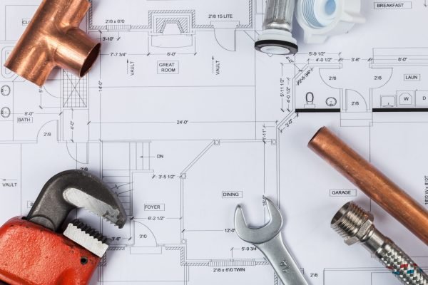 Plumbing Tools Arranged On House Plans